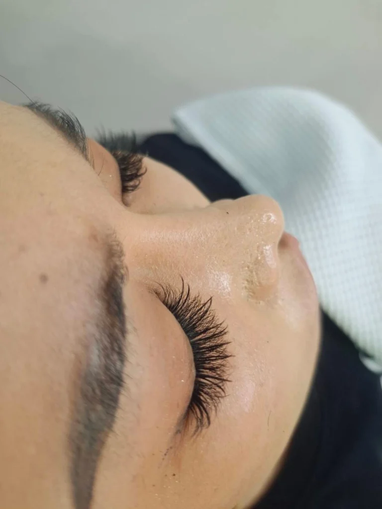 Woman receiving a relaxing facial treatment in Chiang Mai, Thailand.