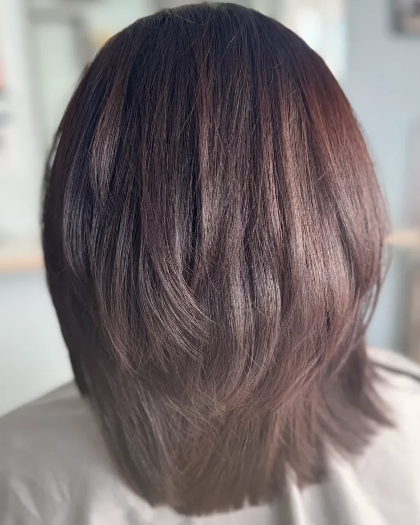 Hair Coloring in Chiang Mai: Woman with freshly colored hair styled to a glossy shine at Praewa's Beauty Salon in Chiang Mai, Thailand.
